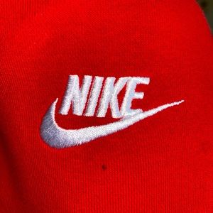 Red Nike hoodie with white nike lettering